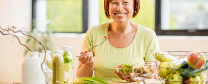 Happy woman enjoying healthy food